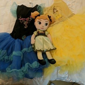 Two adorable Disney dress up dresses and Anna doll